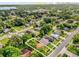 Aerial neighborhood view with single Gathering home outlined. Perfect for Gathering with quiet street. Orlando skyline in distance at 4133 Cepeda St, Orlando, FL 32811