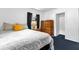 Cozy bedroom featuring blue carpet, white walls, a queen size bed, and ample storage at 4133 Cepeda St, Orlando, FL 32811