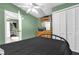 Bedroom featuring a ceiling fan, closet, and a black metal frame bed at 4133 Cepeda St, Orlando, FL 32811