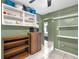 Kitchen featuring white and wooden shelving, and tile flooring at 4133 Cepeda St, Orlando, FL 32811