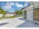 Backyard features a white wooden deck with a fenced-in yard and lush landscaping at 441 S Primrose Dr, Orlando, FL 32803