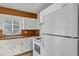 Charming kitchen with white appliances, wooden countertops, and ample cabinet space at 441 S Primrose Dr, Orlando, FL 32803