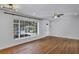 Bright living room with hardwood floors, large windows, and modern lighting at 441 S Primrose Dr, Orlando, FL 32803
