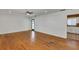 Open-concept living area featuring hardwood floors and a seamless flow to the kitchen at 441 S Primrose Dr, Orlando, FL 32803