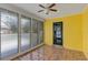 Bright sunroom with tile floors, large windows, and a door to the outside at 441 S Primrose Dr, Orlando, FL 32803