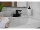 Close-up of bathroom vanity featuring quartz countertop, modern faucet, and elegant decor at 501 Benedict Ct, Casselberry, FL 32707