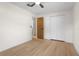 Neutral bedroom with wood floors, ceiling fan and closet at 501 Benedict Ct, Casselberry, FL 32707