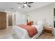Cozy bedroom features a ceiling fan, hardwood floors, and a large closet for ample storage at 501 Benedict Ct, Casselberry, FL 32707