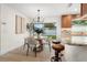 Cozy dining area with a modern table and chairs, adjacent to kitchen and backyard view at 501 Benedict Ct, Casselberry, FL 32707