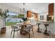 Inviting dining area with modern furnishings, open to the kitchen with natural light and backyard view at 501 Benedict Ct, Casselberry, FL 32707