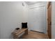 Clean and inviting entryway with storage closet and wood accent bench at 501 Benedict Ct, Casselberry, FL 32707