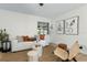Modern living room featuring stylish decor, comfortable seating, and contemporary artwork at 501 Benedict Ct, Casselberry, FL 32707