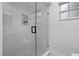 Elegant walk-in shower features stylish tilework, glass enclosure, and modern fixtures at 501 Benedict Ct, Casselberry, FL 32707