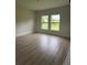 Comfortable bedroom with luxury vinyl flooring, two large windows offering ample natural light at 524 Marion Oaks Blvd, Ocala, FL 34473