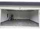 Spacious garage with epoxy flooring, white walls, and a clean, organized appearance at 524 Marion Oaks Blvd, Ocala, FL 34473