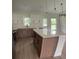 Well-lit kitchen featuring quartz countertops, stainless steel appliances, and a practical island at 524 Marion Oaks Blvd, Ocala, FL 34473