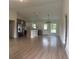 Open-concept kitchen with two-tone cabinetry, stainless steel appliances, and stylish pendant lighting fixtures at 524 Marion Oaks Blvd, Ocala, FL 34473