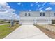 New construction two-story townhome with a two-car garage and extended driveway at 5625 Brosnan Rd, St Cloud, FL 34771