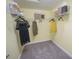 Spacious walk-in closet providing ample storage with organized shelving and hanging space at 5832 Meditation Dr, Clermont, FL 34714