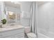 Clean bathroom featuring white subway tiles, a modern vanity, and contemporary fixtures at 6005 Blue View Way, St Cloud, FL 34771