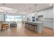 Open concept kitchen with stainless steel appliances, island with seating, and natural lighting at 6005 Blue View Way, St Cloud, FL 34771