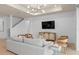 Comfortable living room with stylish decor, hardwood floors, and modern lighting fixtures at 6005 Blue View Way, St Cloud, FL 34771