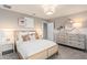 Comfortable main bedroom featuring neutral tones, stylish decor, and a calming ambiance at 6005 Blue View Way, St Cloud, FL 34771