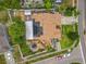 Overhead shot of a home with solar panels, featuring a landscaped yard and residential surroundings at 6902 Coral Cove Dr, Orlando, FL 32818
