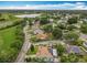 Aerial shot showcasing a home near a lake and lush greenery in a residential neighborhood at 6902 Coral Cove Dr, Orlando, FL 32818