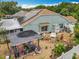 Aerial view of backyard area with covered BBQ, shed, solar panels and a privacy fence at 6902 Coral Cove Dr, Orlando, FL 32818