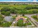 Aerial view of a home with solar panels, highlighting neighborhood and nearby greenery at 6902 Coral Cove Dr, Orlando, FL 32818