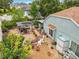 Aerial view of the backyard featuring a covered grill, seating area, landscaping, and privacy fence at 6902 Coral Cove Dr, Orlando, FL 32818