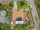 Bird's-eye view of a home featuring solar panels, landscaped grounds, and neighborhood setting at 6902 Coral Cove Dr, Orlando, FL 32818