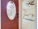 Entryway showcases an ornate front door and a glimpse of the tiled floors and a day bed at 6902 Coral Cove Dr, Orlando, FL 32818