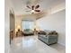 Inviting living room with tiled floors, vaulted ceilings, and a comfortable seating area at 6902 Coral Cove Dr, Orlando, FL 32818
