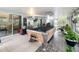 Enjoy a large, screened lanai perfect for recreation with a pool table and additional seating areas at 6902 Coral Cove Dr, Orlando, FL 32818