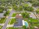 Aerial view of neighborhood with mature trees and manicured lawns at 8676 Hillside Dr, Orlando, FL 32810