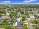 Aerial view of a residential neighborhood full of mature trees and lush landscaping at 8676 Hillside Dr, Orlando, FL 32810