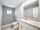 The bathroom has a walk-in shower, vanity with a white cabinet, and a big mirror at 8676 Hillside Dr, Orlando, FL 32810