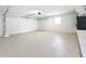 The spacious garage offers ample storage and parking with bright lighting and a new floor at 8676 Hillside Dr, Orlando, FL 32810