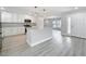 Modern kitchen with white cabinetry, granite countertops, and stainless-steel appliances at 8676 Hillside Dr, Orlando, FL 32810