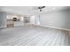 A spacious living room with light hardwood floors and an open-concept layout at 8676 Hillside Dr, Orlando, FL 32810