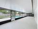 Spacious covered patio with view of the fenced backyard and pool at 8676 Hillside Dr, Orlando, FL 32810