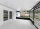 View of covered patio with double door entry for convenient pool access at 8676 Hillside Dr, Orlando, FL 32810