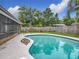 Backyard pool with patio and fenced yard; ideal for hot summer days at 8676 Hillside Dr, Orlando, FL 32810