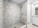 Bathroom features a glass-enclosed shower with modern fixtures at 8676 Hillside Dr, Orlando, FL 32810