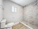 Bathroom features a glass-enclosed shower with modern fixtures at 8676 Hillside Dr, Orlando, FL 32810