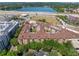 Wide aerial shot of complex with in-ground pool near large lake with highway access at 911 N Orange Ave # 440, Orlando, FL 32801