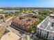 Aerial view of complex surrounded by lush landscaping, overlooking a nearby lake and highway at 911 N Orange Ave # 440, Orlando, FL 32801