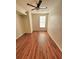 Bright bedroom boasts hardwood floors, a ceiling fan, and a window, creating a functional and inviting space at 911 N Orange Ave # 440, Orlando, FL 32801